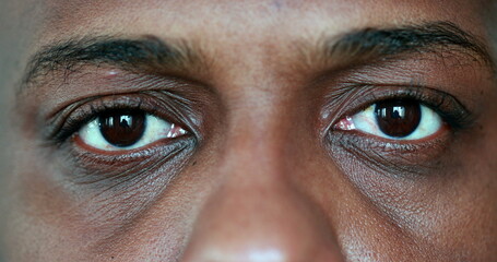 African man meditating close-up eyes