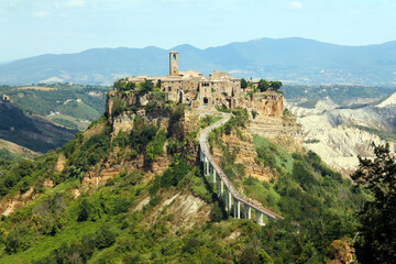Close op of the historical civita village of Bagnoregio standing on a cliff with the long...