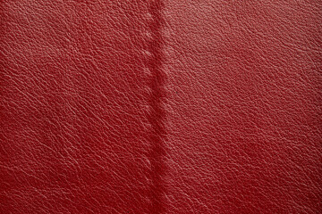 Red leather texture background. Luxury genuine textile surface material wallpaper with furniture backdrop. Close up of fashion fabric