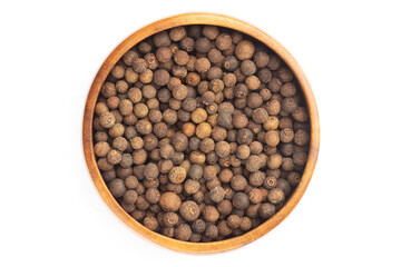 Spice Allspice in wooden bowl on white background. Flat lay. Healthy eating concept