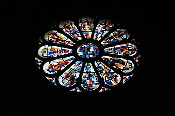 Rose stained glass window in church (Notre-Dame de Liesse, Annecy, France)