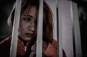 Fototapeta na wymiar Hands of women desperate to catch the iron prison,prisoner concept,thailand people,Hope to be free,If the violate the law would be arrested and jailed.