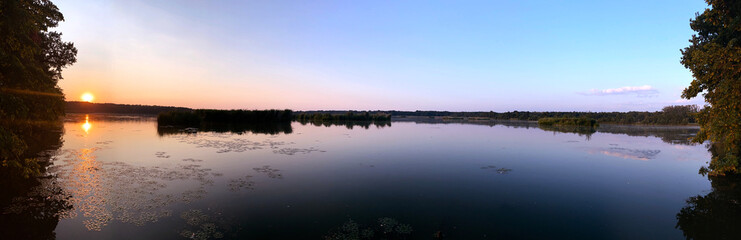 Fototapeta na wymiar Panorama of Lake on Sunset with Trees