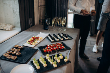 buffet, catering, various canapes and salads in a glass