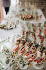 buffet, catering, various canapes and salads in a glass
