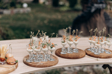 buffet, catering, various canapes and salads in a glass