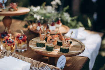 buffet, catering, various canapes and salads in a glass
