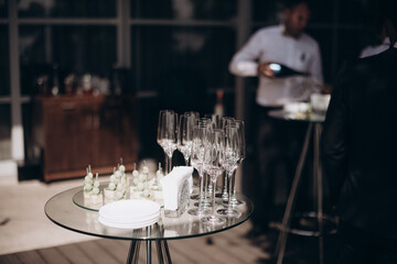 many empty clean glasses for champagne or white wine