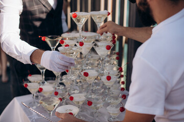 pyramid of champagne glasses at an event