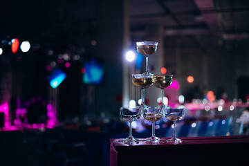 pyramid of champagne glasses at an event