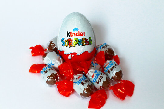 Italy &ndash; April 6, 2022: Kinder Surprise Chocolate Eggs and Schoko-Bons. Kinder is a brand of food products of Ferrero