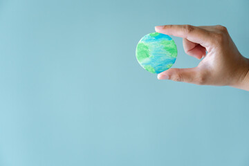 Hands holding earth. Concept of protecting the world from global warming.