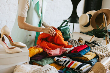 middle aged woman female woman at swap party try on clothes, bags, shoes and accessories, change...