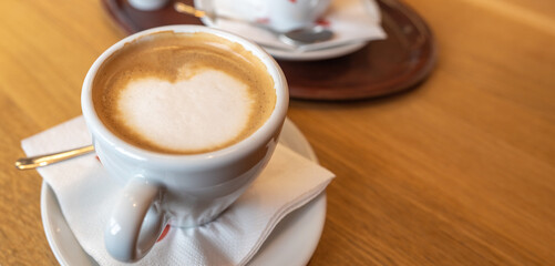 small cup of coffee with foamed milk