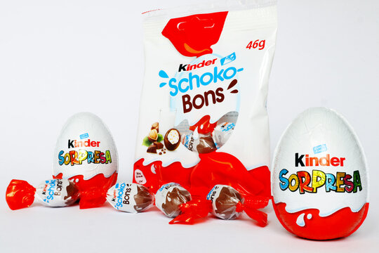 Italy &ndash; April 6, 2022: Kinder Surprise Chocolate Eggs and Schoko-Bons. Kinder is a brand of food products of Ferrero