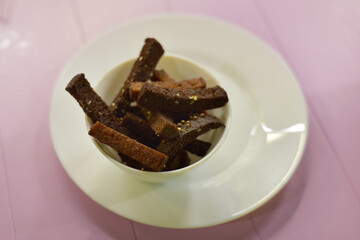 Croutons with chasnok in a white plate