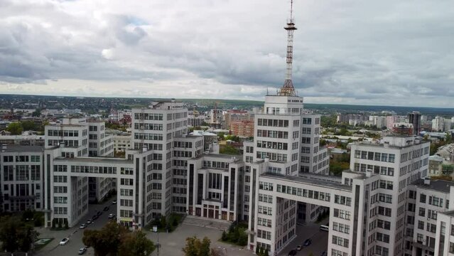 Aerial view on Derzhprom historic constructivist architecture building from Freedom Svobody Square with epic cloudscape in Kharkiv city, Ukraine