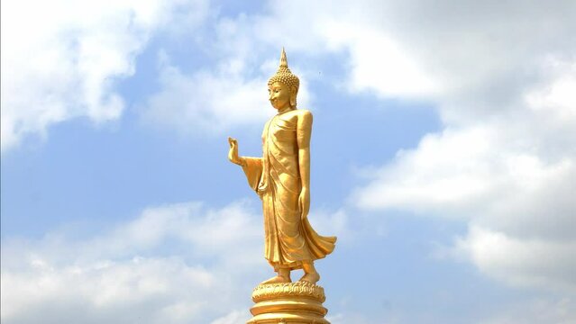 Time lapse : The standing buddha with blue sky and clounds , Chanthaburi Thailand