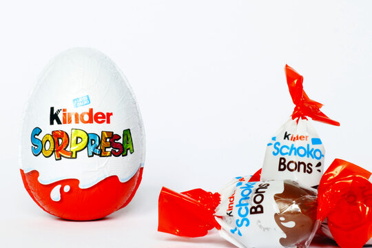 Italy &ndash; April 6, 2022: Kinder Surprise Chocolate Eggs and Schoko-Bons. Kinder is a brand of food products of Ferrero