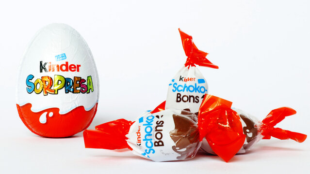 Italy &ndash; April 6, 2022: Kinder Surprise Chocolate Eggs and Schoko-Bons. Kinder is a brand of food products of Ferrero
