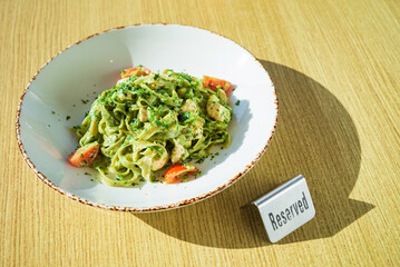 pasta with pesto on the table