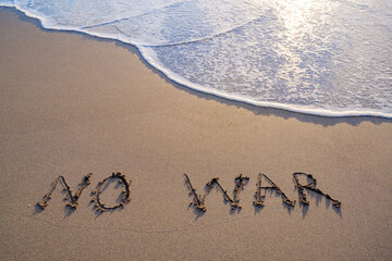 Fototapeta premium writing in the sand no war