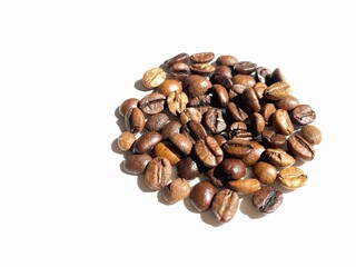 Rosted coffee beens closeup on white isolated background