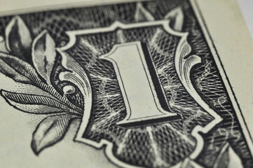 The number 1 on the US dollar bill. Close-up