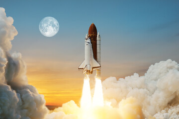Spaceship lift off. Space shuttle with smoke and blast takes off into space on a background of a...