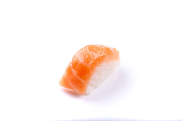 just one piece of raw salmon nigiri sushi with rice japanese food close up cut angle isolated on white background