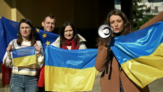 Protest against the war in Ukraine and the Russian invasion. People with flags at a demonstration in support of Ukraine.