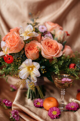 Fall table setting with oranges and fall bouquet 