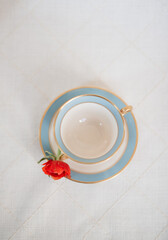 Obraz na płótnie Canvas Tea Cup from Above with Red Rose
