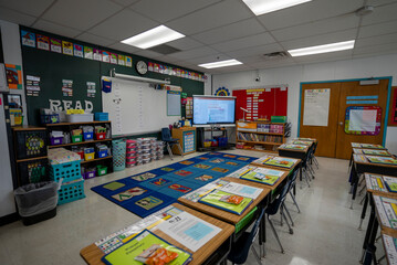 Wide angle view of empty elementary school classroom in the US.