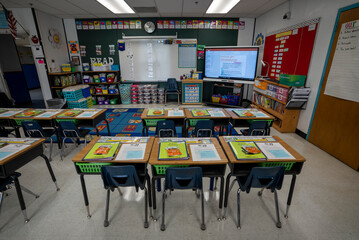 Wide angle view of empty elementary school classroom in the US.