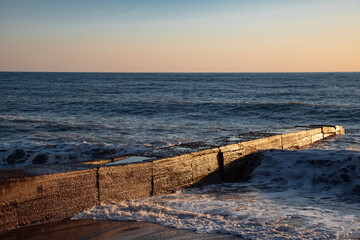 Sea sunset. The Black Sea coast. Tourism and travel. The coastline. Rocks on the shore.