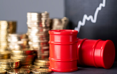 Red barrels, stacks of money and a rising curve symbolizing high fuel prices