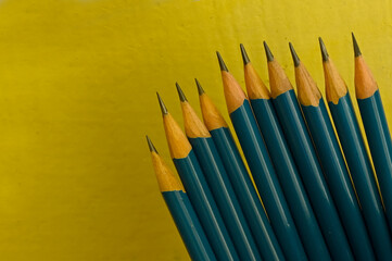 closeup of pencil isolated on yellow background