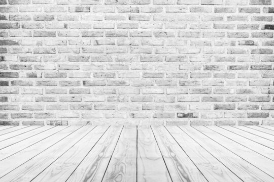 Empty white wood table top with brick wall background