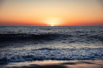 Obraz premium The sea wave. Sunset in the sea. The power of the elements.
