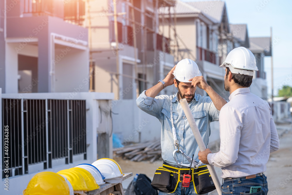 Poster architect,foreman and worker discussing in building construction site in construction site,construct