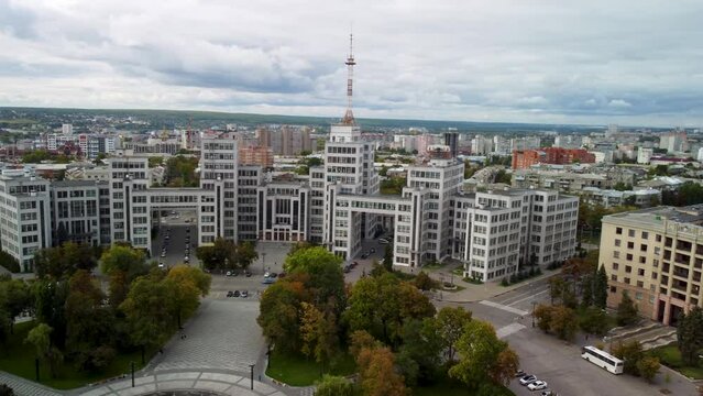 Autumn city, left to right aerial Freedom Square. View on Derzhprom historic constructivist architecture building and Nauky Ave with epic cloudscape in Kharkiv, Ukraine