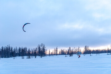 kiting in the winter mountains in russia