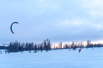 kiting in the winter mountains in russia