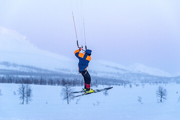 kiting in the winter mountains in russia