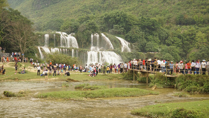 Ban Gioc Waterfall during public holiday with big crowds in Vietnam.