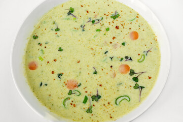 Detail of surface of creamy broccoli soup.