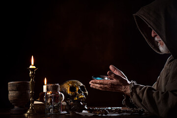 Magician in the Middle Ages with bowl of magic powder