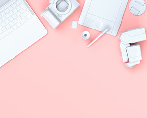 Top view of designer workspace and photography gear on black table background