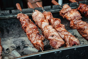 meat skewers are fried on the grill or shish kebab cooked on hot coals